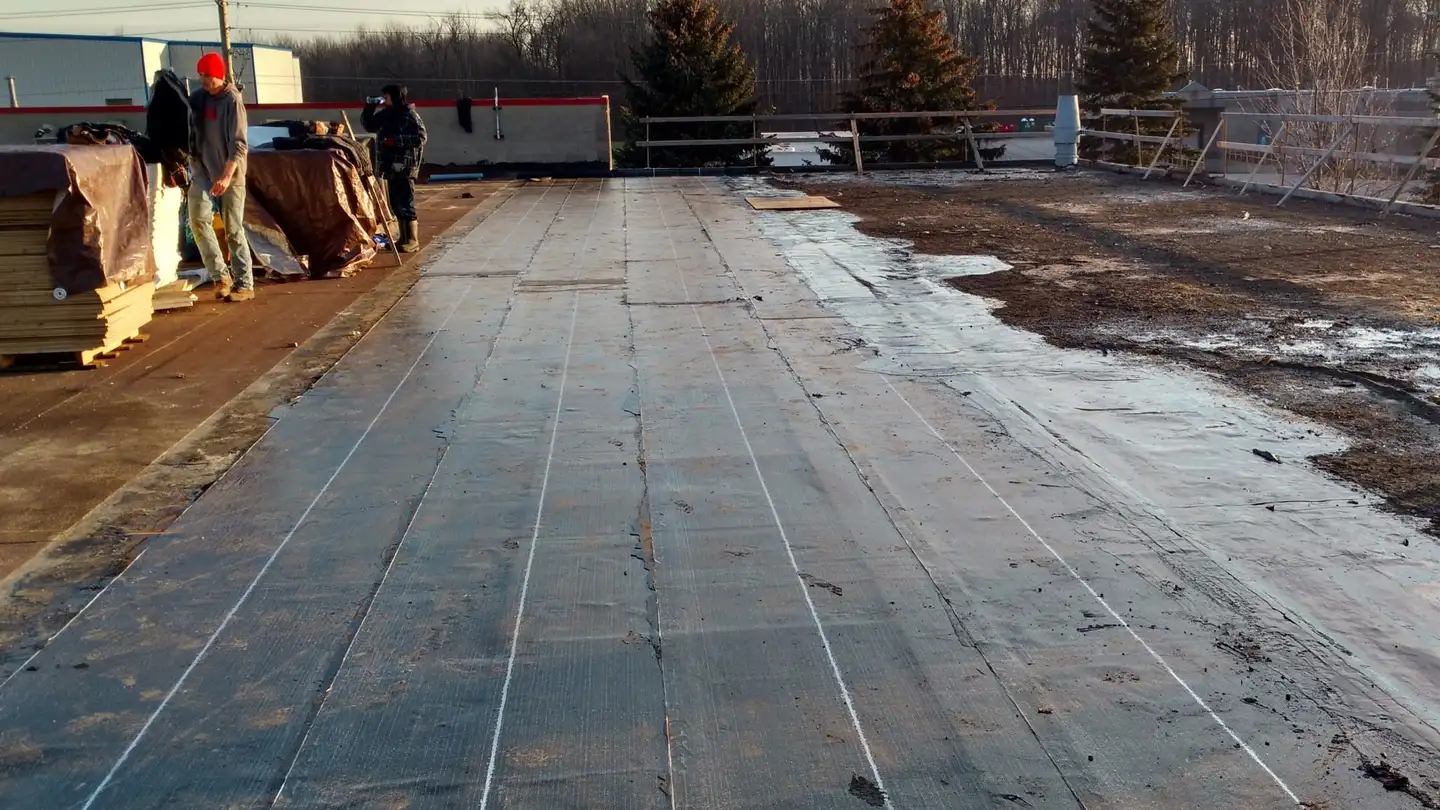 A flat roof part way through an SBS modified membrane installation