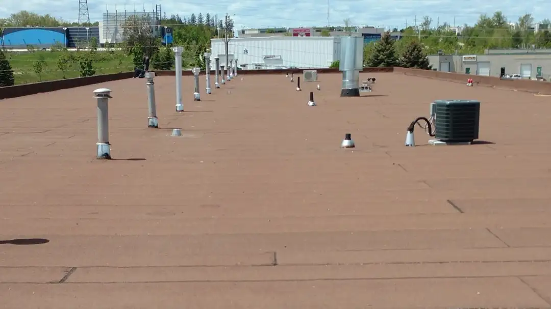 A completed SBS modified bitumen roof system on a commercial building