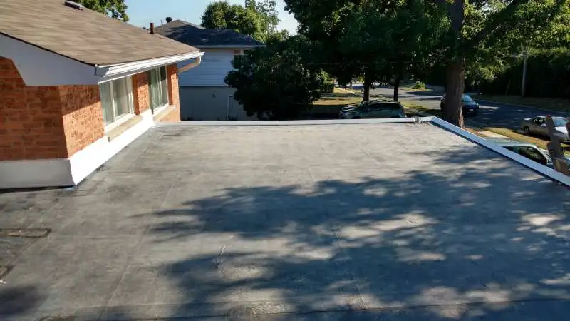 An EPDM single-ply membrane roof on a flat commercial building