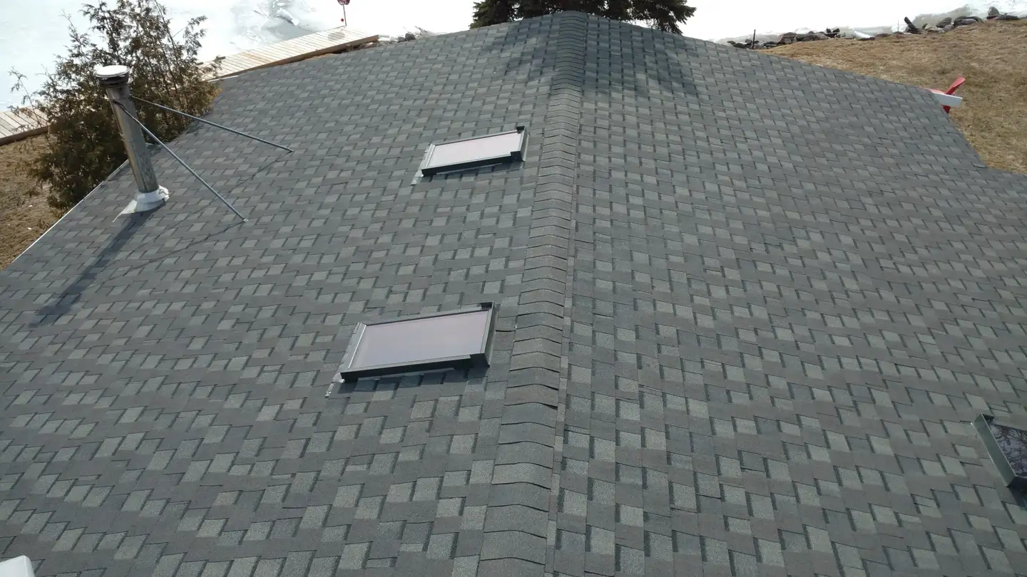 A Raymond Desrochers Roofing crew at work on a roof in Simcoe County